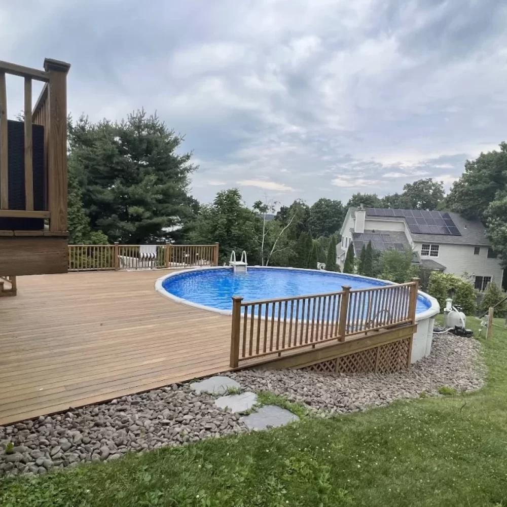 A photo of a deck in a suburban neighborhood designed by Ophir Design Concepts